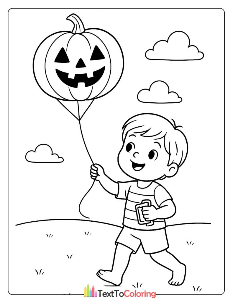 A boy is holding a jack-o-lantern balloon, walking in a field.