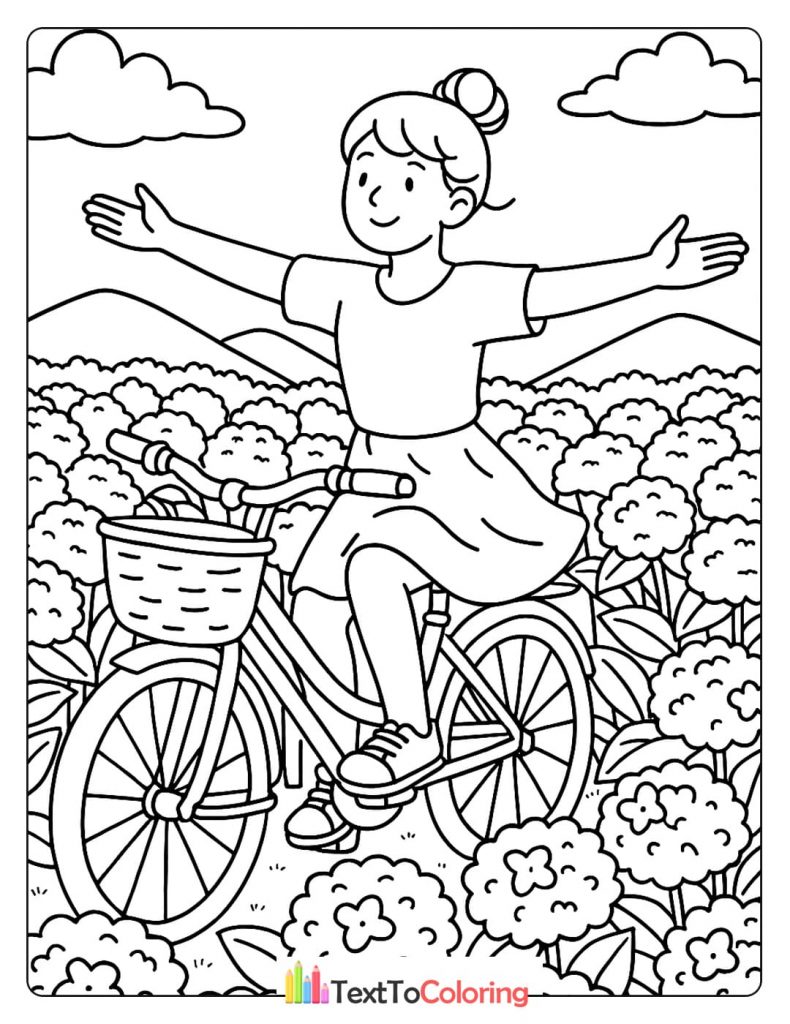 A girl happily rides a bicycle with her arms outstretched in a field of flowers.
